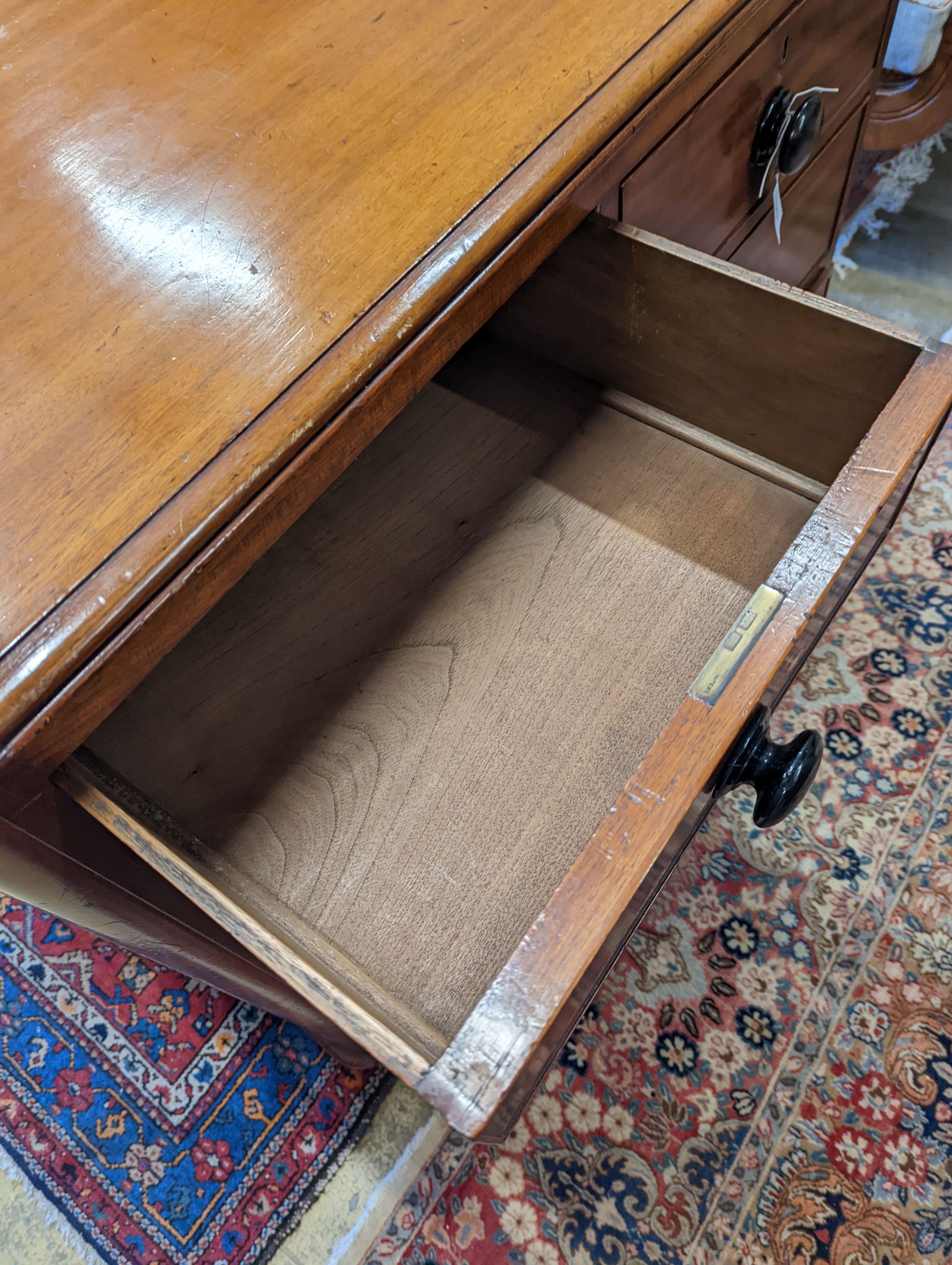 A mahogany chest of two short and three long drawers with turned handles, width 105cm, depth 53cm, height 106cm